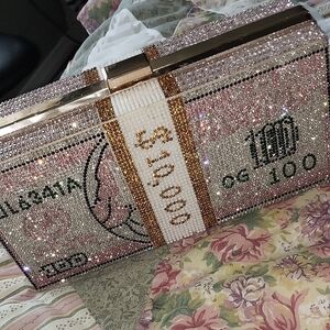 New, never used pink jeweled money clutch bag